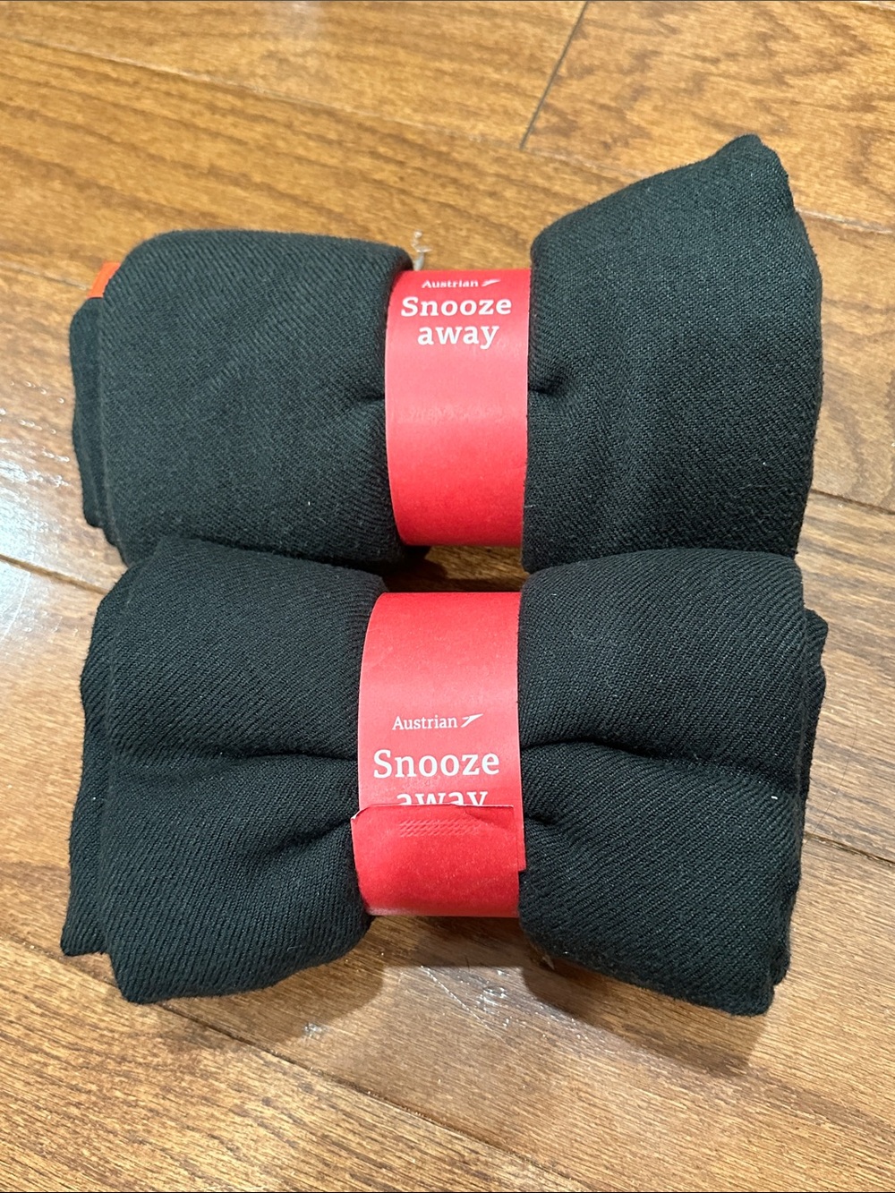 Austrian Airlines "Snooze Away" rolled black fleece travel blanket—Pack of 2